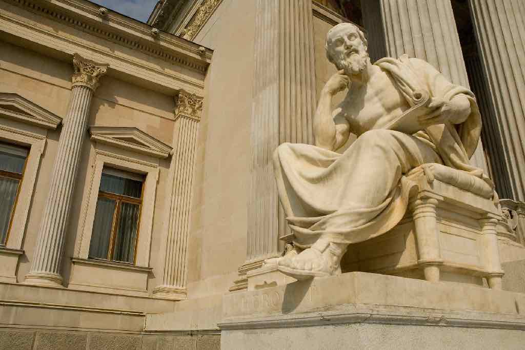 A stone statue of a famous philosopher in Oxford